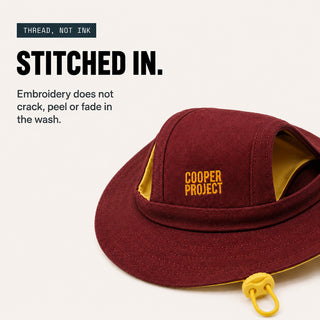 Close-up of the embroidery on the Blue Dog Bucket Hat — Yellow Lining