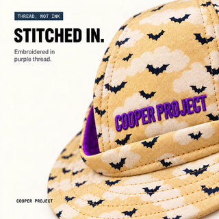 Close-up of the embroidery on the Cloudy Bats Dog Bucket Hat
