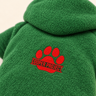 Close-up of the embroidered Cooper Project paw on forest fleece