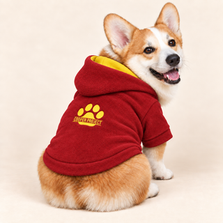 Corgi wearing a red dog fleece hoodie, seated, rear three-quarter view, head turned