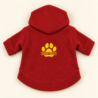 Red dog fleece hoodie laid flat, back view, embroidered Cooper Project paw