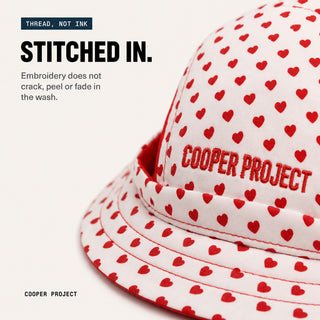Close-up of the embroidery on the Hearts Dog Bucket Hat