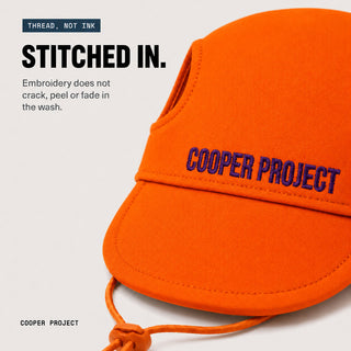 Close-up of the embroidery on the Orange Dog Cap