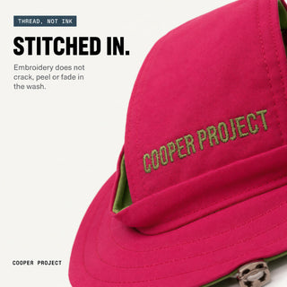 Close-up of the embroidery on the Pink Dog Bucket Hat — Yellow Lining