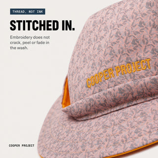 Close-up of the embroidery on the Rose Floral Dog Bucket Hat — Orange Lining