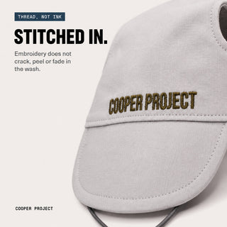 Close-up of the embroidery on the Stone Dog Cap