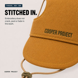 Close-up of the embroidery on the Tan Dog Cap