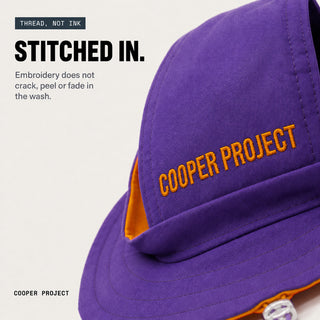 Close-up of the embroidery on the Violet Dog Bucket Hat — Sage Lining